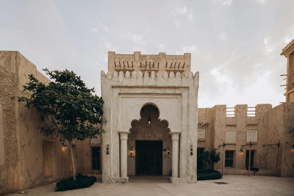 Experience the timeless beauty of traditional Arabic architecture in a tranquil Dubai courtyard.
