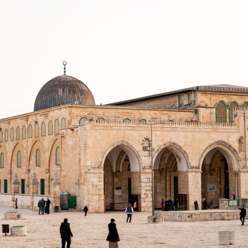 View of Al-Aqsa Mosque with visitors, capturing the architectural beauty in Jerusalem.