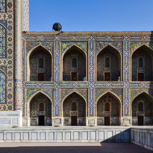 View of a beautifully ornate and traditional madrasa facade in Tashkent, showcasing intricate tile work.