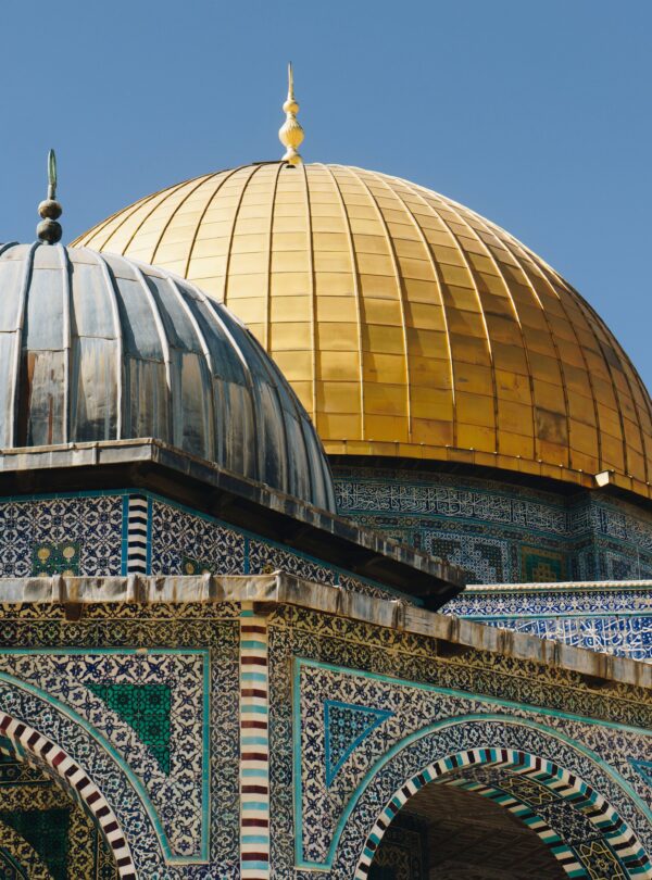 Brightly detailed capture of the iconic Dome of the Rock in Jerusalem, showcasing intricate Islamic architecture.