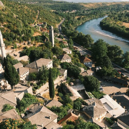 Explore the scenic beauty of Počitelj village with its Ottoman architecture and the winding Neretva River.