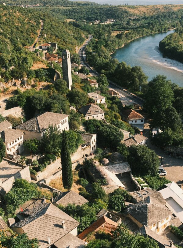 Explore the scenic beauty of Počitelj village with its Ottoman architecture and the winding Neretva River.