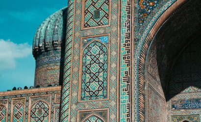 Detailed view of ornate mosaic patterns on Islamic architecture in Uzbekistan, showcasing historic design.