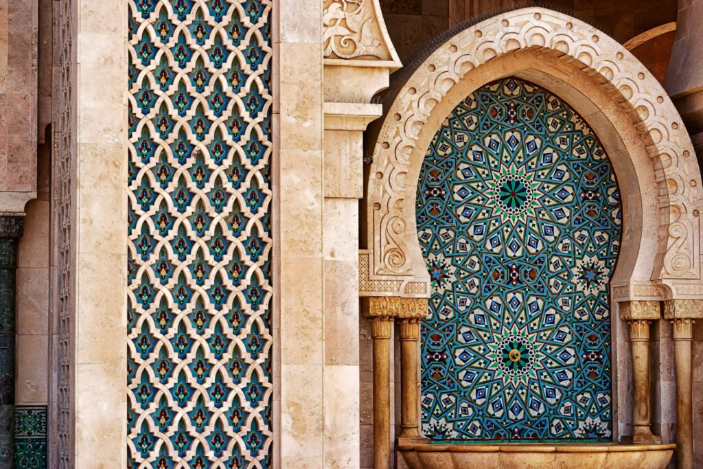 Detailed view of traditional Moorish tilework showcasing intricate patterns and vibrant colors in historic architecture.