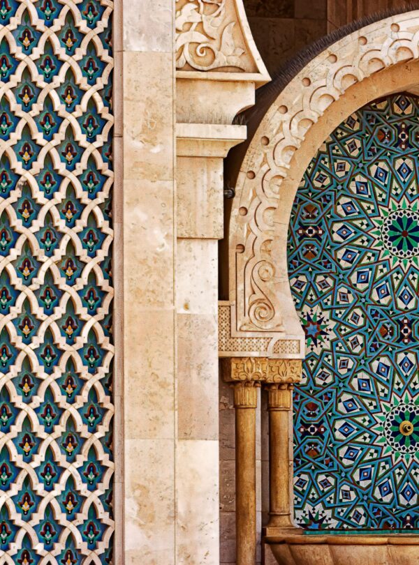 Detailed view of traditional Moorish tilework showcasing intricate patterns and vibrant colors in historic architecture.